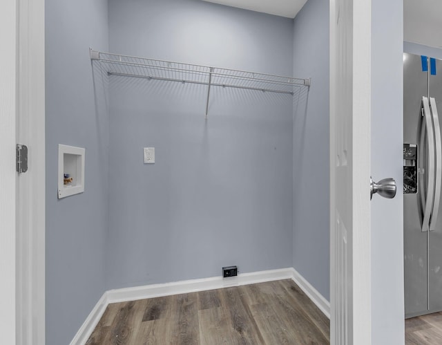 washroom with washer hookup and hardwood / wood-style floors