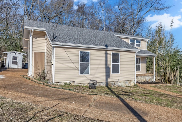 view of home's exterior featuring a storage unit