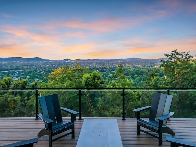 balcony at dusk with a mountain view