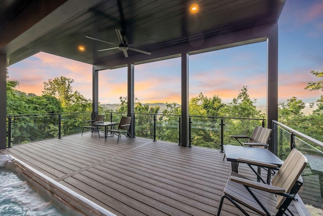 deck at dusk with ceiling fan