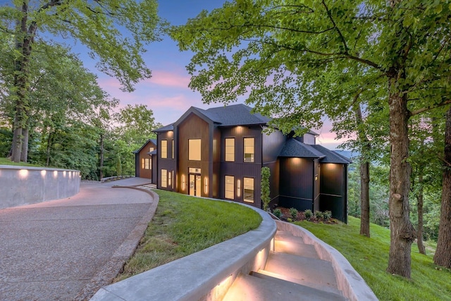 contemporary home featuring a yard