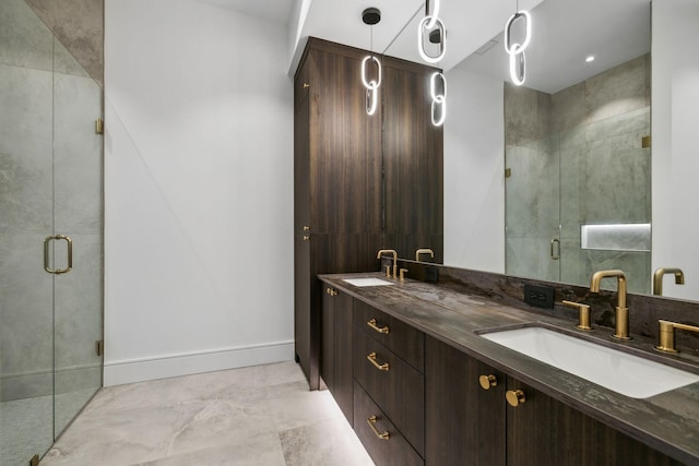 bathroom featuring vanity and an enclosed shower