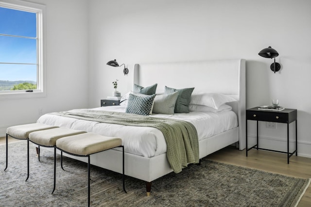 bedroom featuring dark hardwood / wood-style flooring