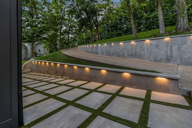 view of swimming pool featuring a yard and a patio