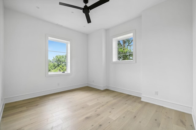 empty room featuring ceiling fan and light hardwood / wood-style flooring