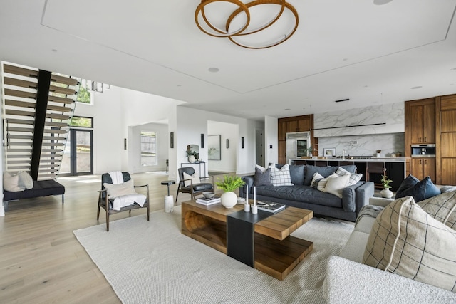 living room featuring light hardwood / wood-style floors and sink