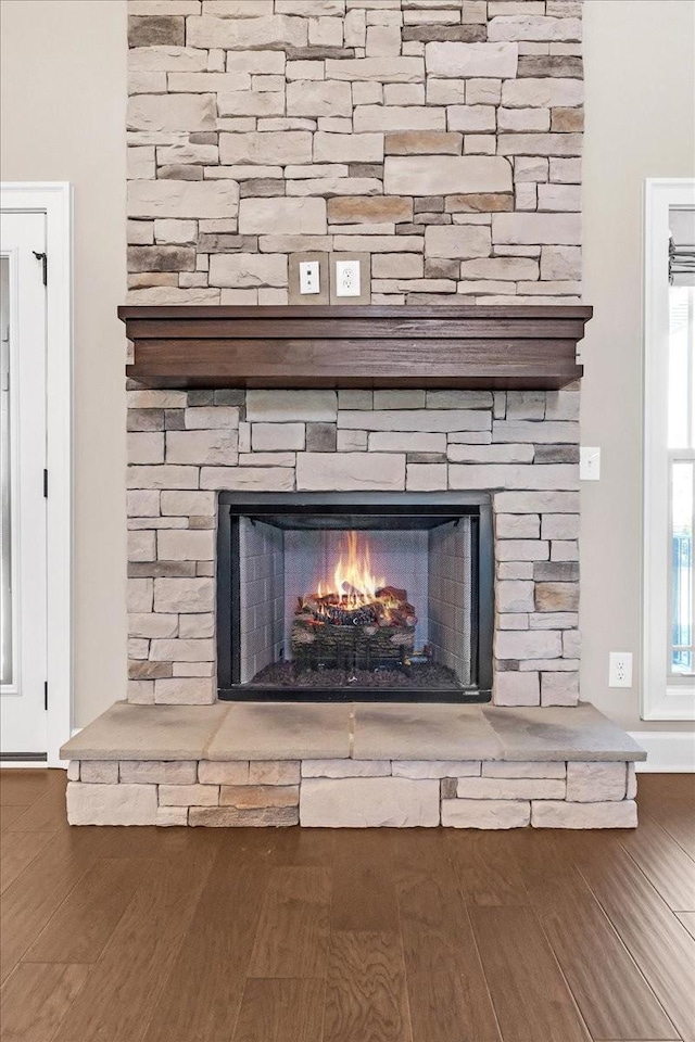 interior details with a fireplace and hardwood / wood-style flooring