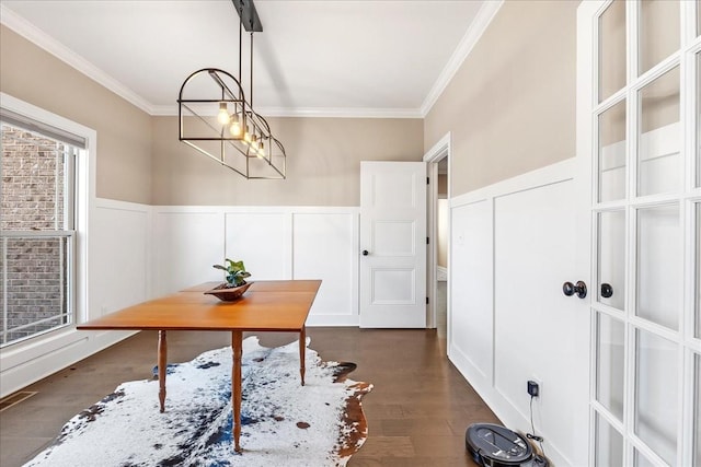 office featuring crown molding, breakfast area, and dark wood-type flooring