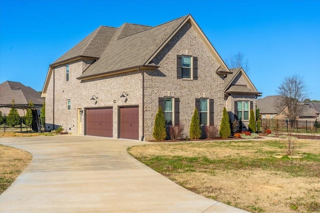 view of front facade featuring a front lawn and a garage