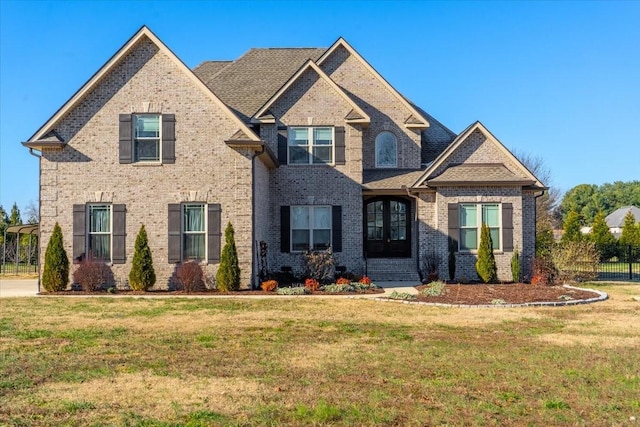 craftsman-style home with a front yard