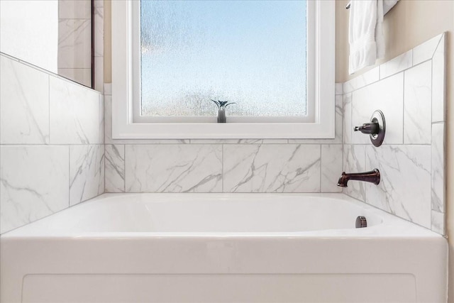 bathroom featuring a tub to relax in