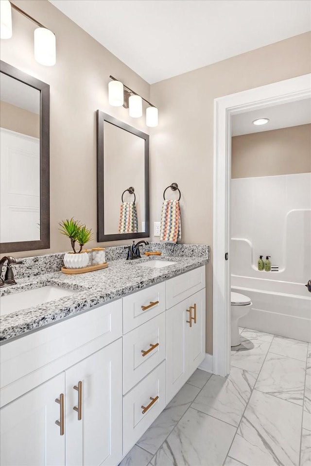 full bathroom featuring vanity, shower / bathtub combination, and toilet