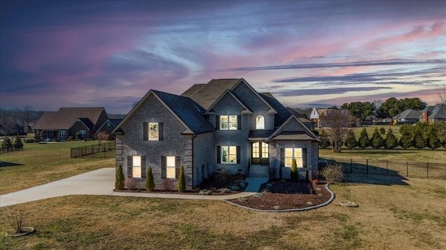 view of front of property with a lawn