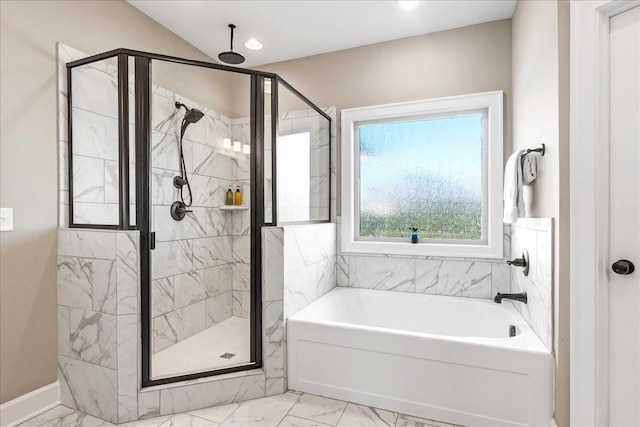 bathroom with shower with separate bathtub and vaulted ceiling