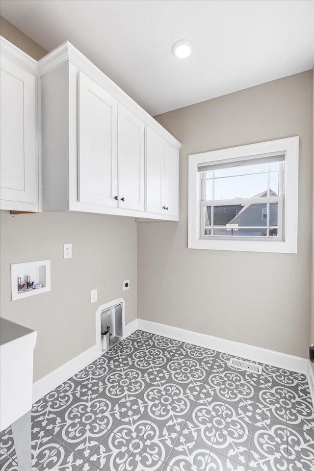 laundry room featuring washer hookup, cabinets, and hookup for an electric dryer