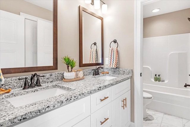 full bathroom with vanity, shower / bath combination, and toilet