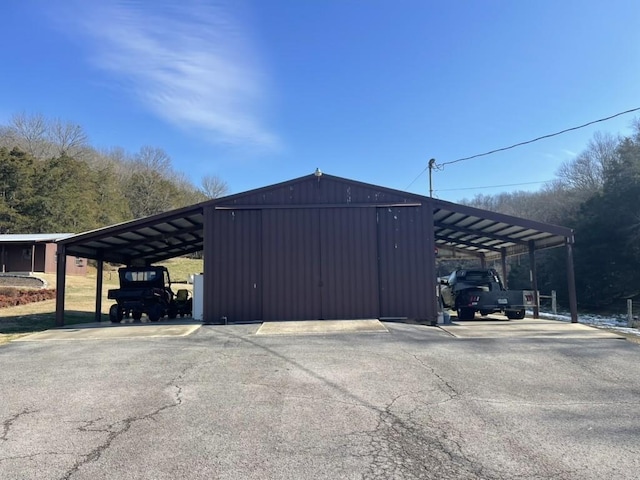 view of parking / parking lot with a carport