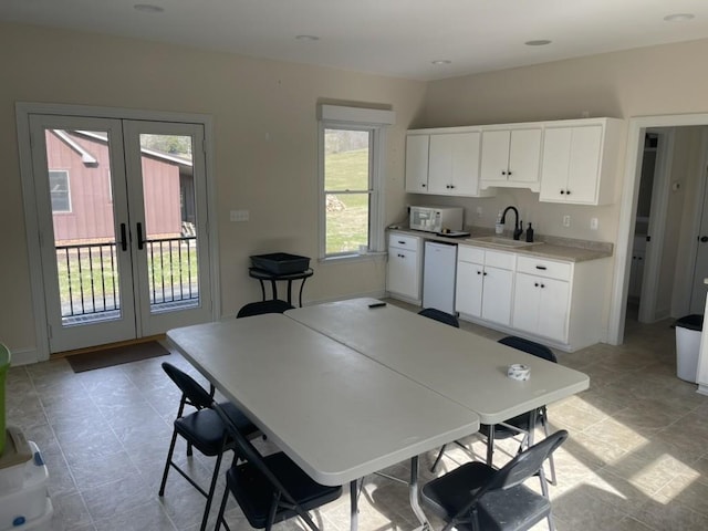 dining room with sink and french doors