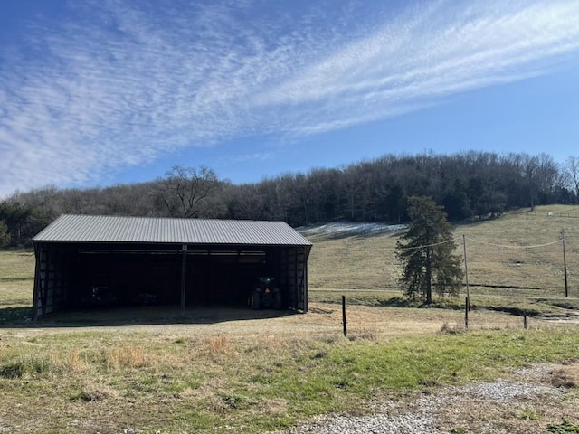 view of outbuilding featuring a rural view