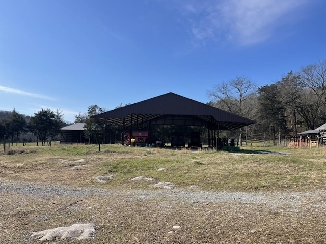 exterior space with a carport and a rural view