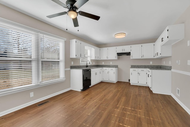 kitchen featuring ceiling fan, white cabinets, stone countertops, and black dishwasher