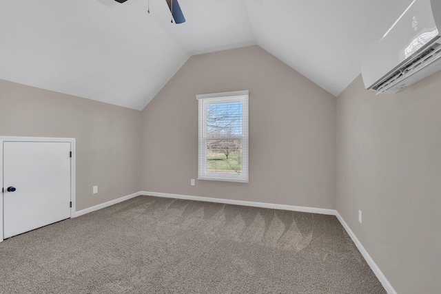 additional living space featuring a wall unit AC, ceiling fan, carpet floors, and vaulted ceiling