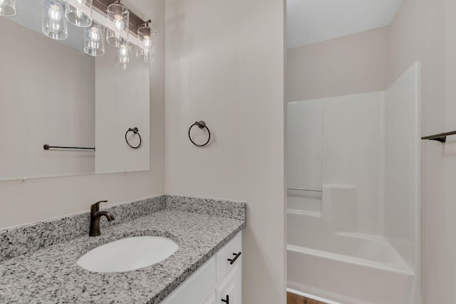 bathroom featuring vanity and shower / bath combination