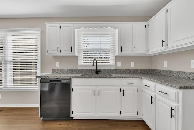 kitchen featuring white cabinets, sink, dark hardwood / wood-style floors, black dishwasher, and light stone counters