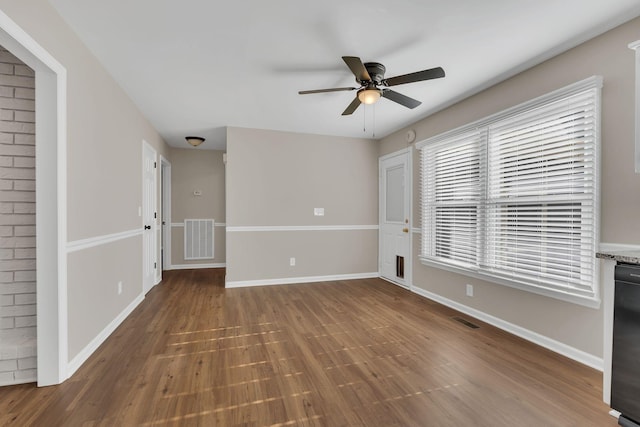 interior space with ceiling fan and wood-type flooring