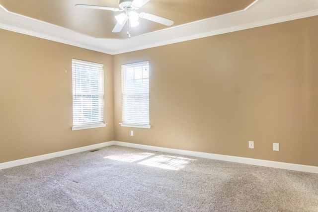 carpeted empty room featuring crown molding and ceiling fan