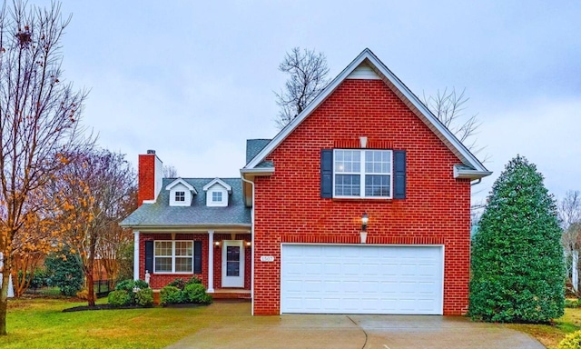 front facade featuring a garage and a front lawn