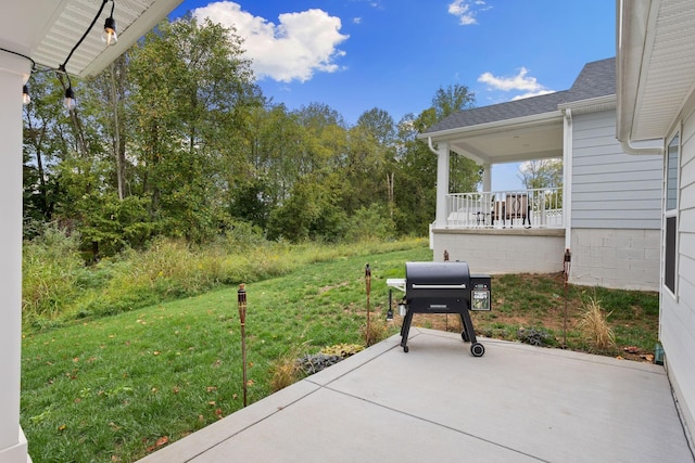 view of patio featuring area for grilling and a porch