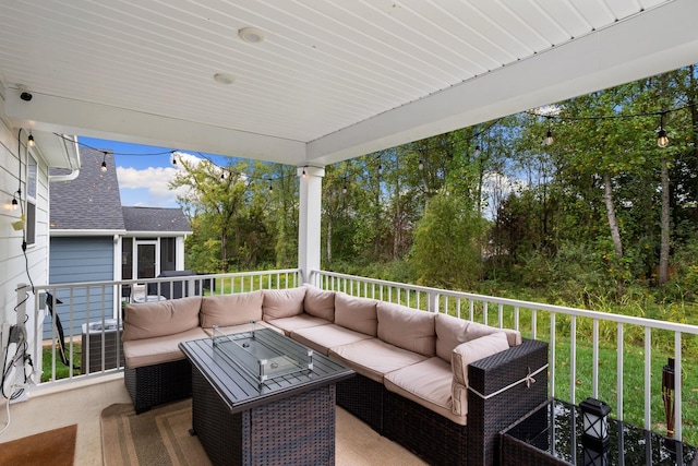 wooden terrace featuring an outdoor living space