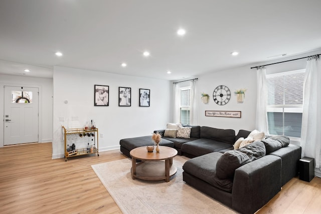 living room with light hardwood / wood-style flooring