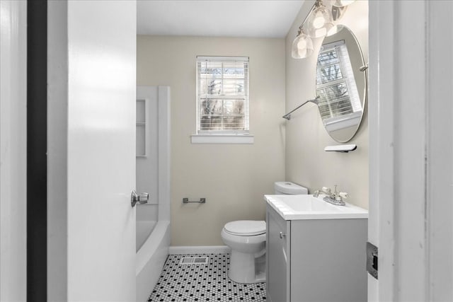 bathroom with tile patterned floors, vanity, and toilet