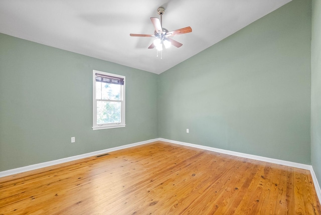 spare room with ceiling fan and wood-type flooring