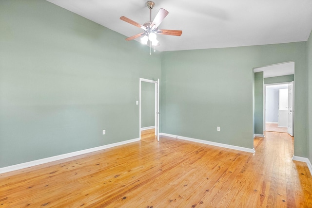 unfurnished room with light hardwood / wood-style flooring, ceiling fan, and lofted ceiling