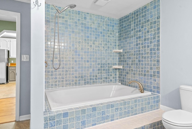 bathroom with tile patterned flooring and toilet