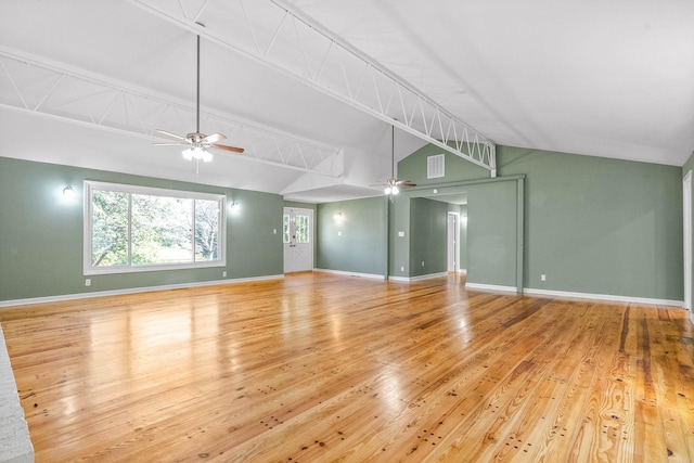 unfurnished living room featuring ceiling fan, light hardwood / wood-style floors, and vaulted ceiling