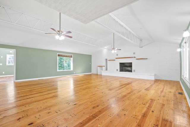 unfurnished living room with hardwood / wood-style floors and ceiling fan