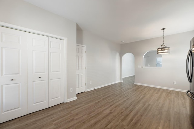 unfurnished living room featuring hardwood / wood-style floors