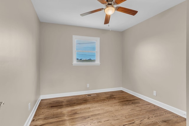 empty room featuring ceiling fan and light wood-type flooring