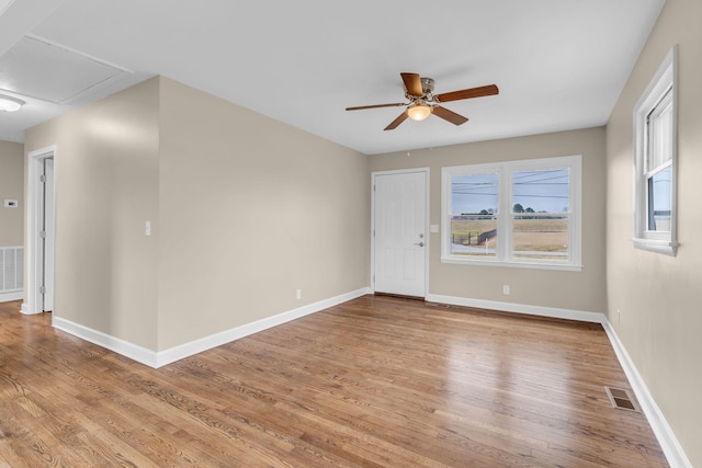 unfurnished room featuring ceiling fan and light hardwood / wood-style flooring