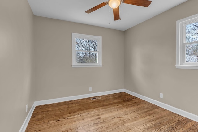 empty room featuring ceiling fan and light wood-type flooring