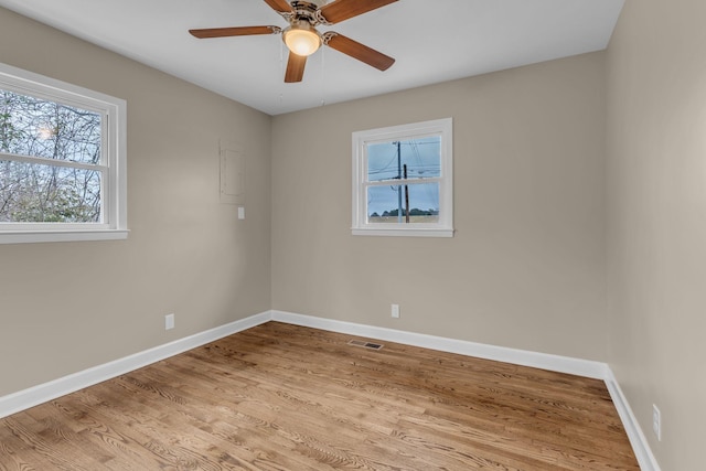 empty room featuring ceiling fan and light hardwood / wood-style flooring