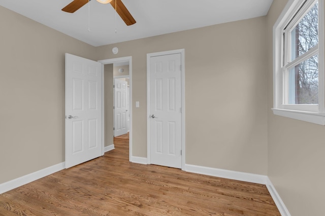 unfurnished bedroom with light hardwood / wood-style floors and ceiling fan