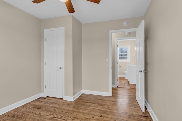 unfurnished bedroom featuring hardwood / wood-style flooring and ceiling fan