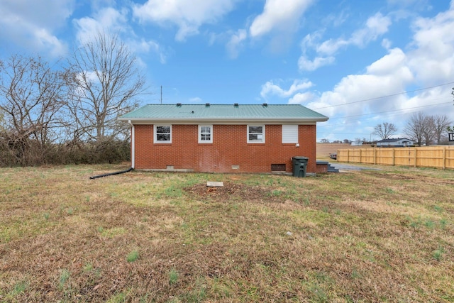 back of property with a lawn