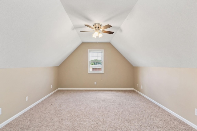 bonus room with carpet, vaulted ceiling, and ceiling fan