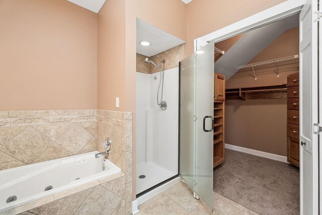 bathroom with separate shower and tub and tile patterned floors